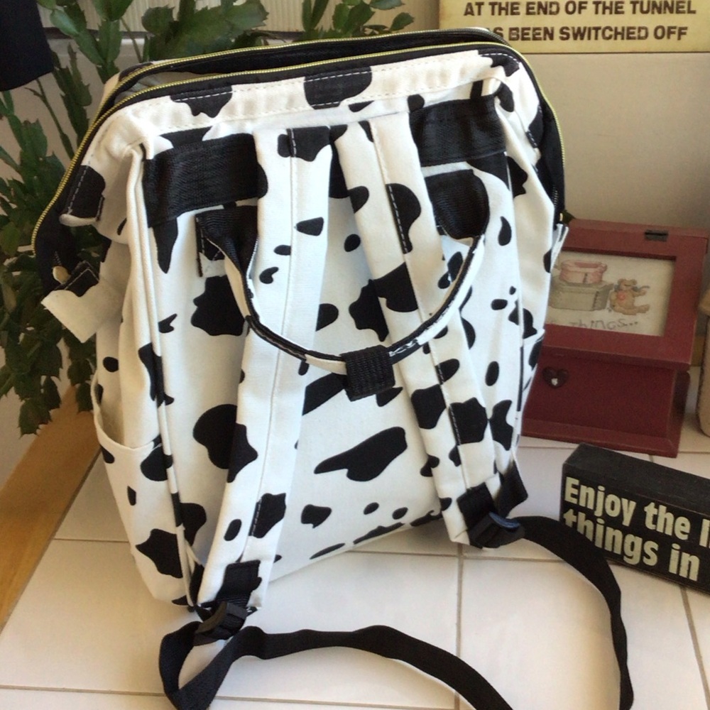 ‘Living Traveling Share’ Canvas Cow Print Backpack - Picture 6 of 8